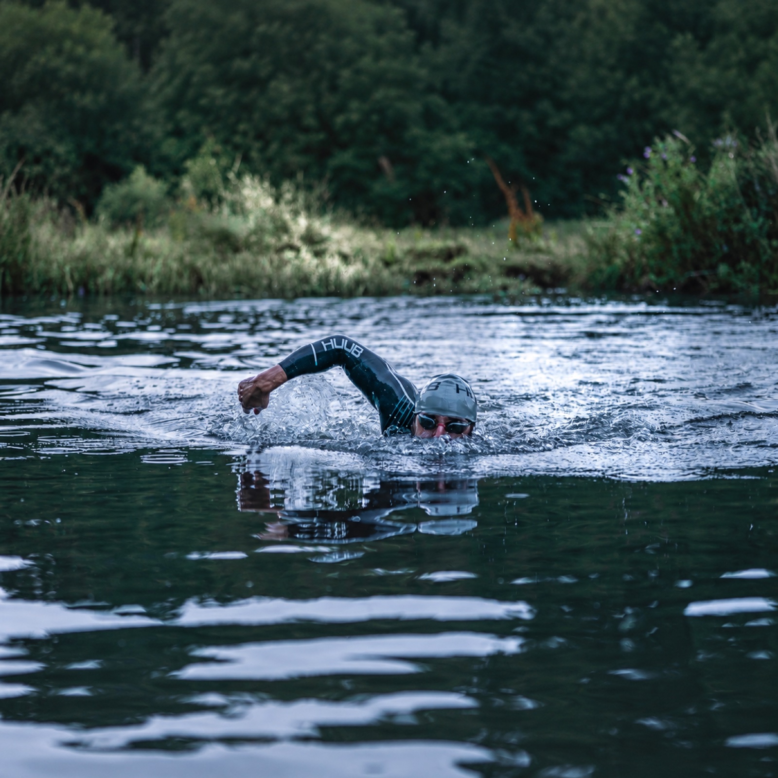 Open-water swimmer training in a lake