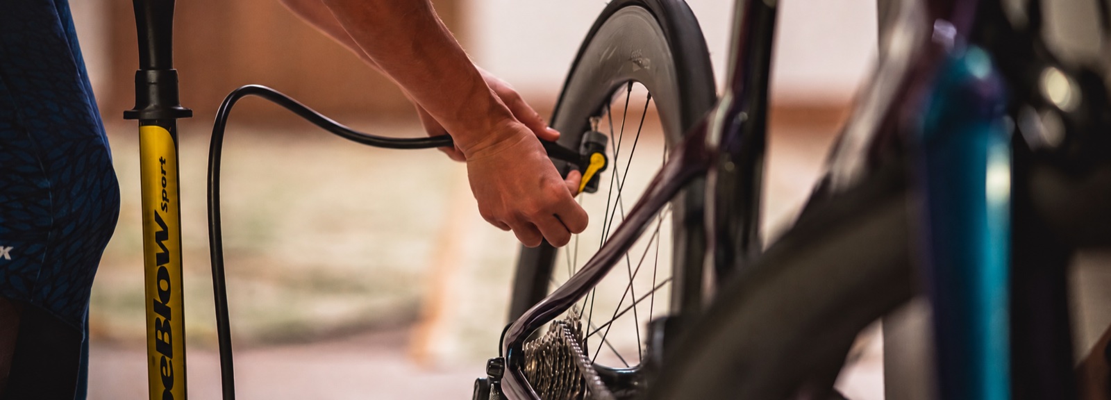Cyclist inflating a bicycle tyre